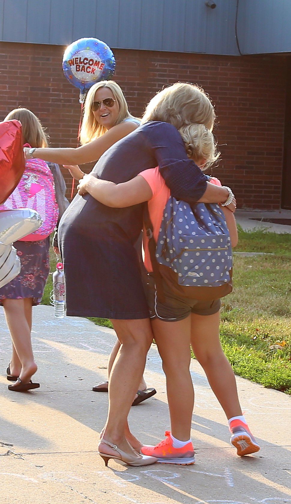 A hug from the principal